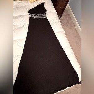 Black one shoulder formal gown with silver accent bead work.